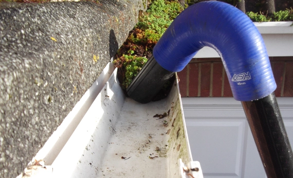 Siding stains due to gutter overflow