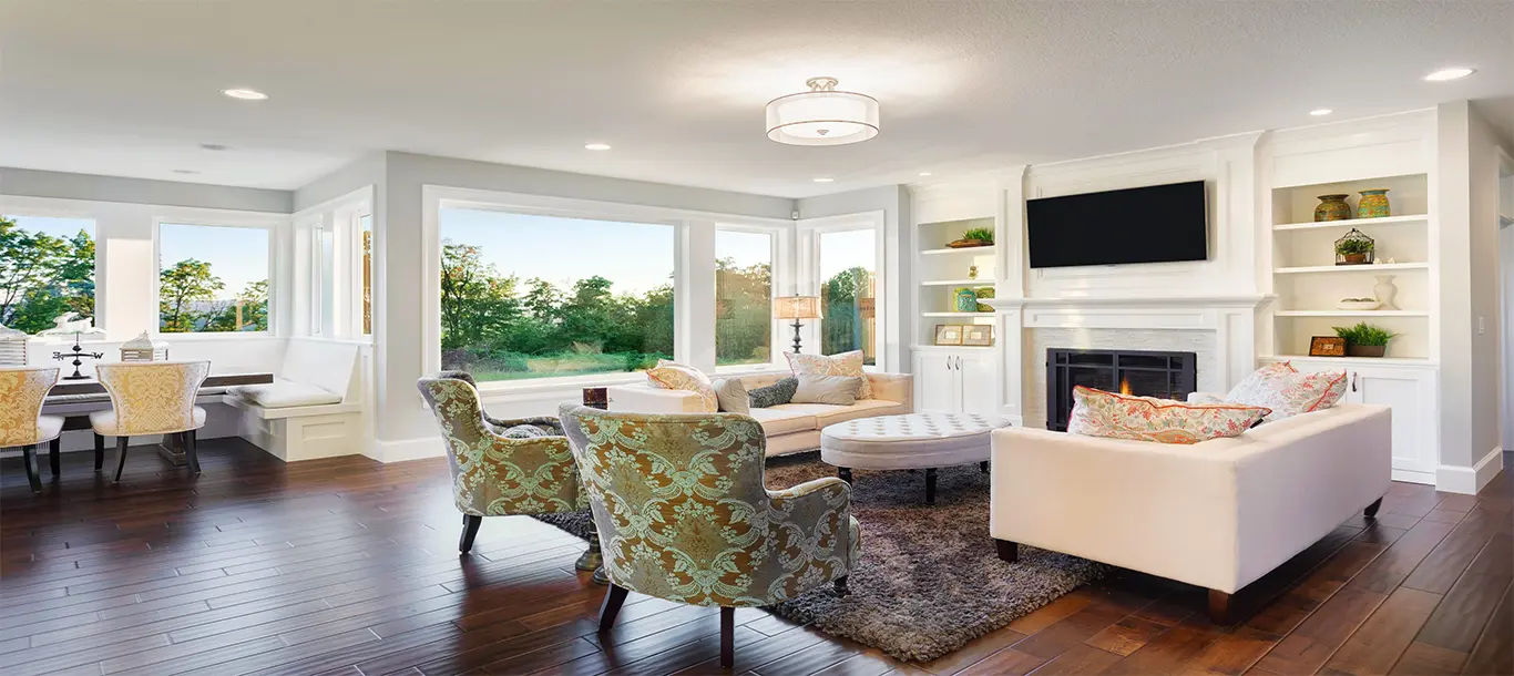 Sunlit living room with sparkling picture windows after professional cleaning